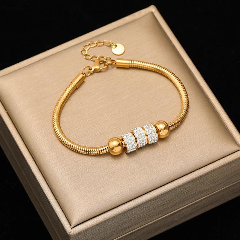 Pulseira de Aço Inoxidável Torcida Banhada a Ouro 18k - Heraki Joias