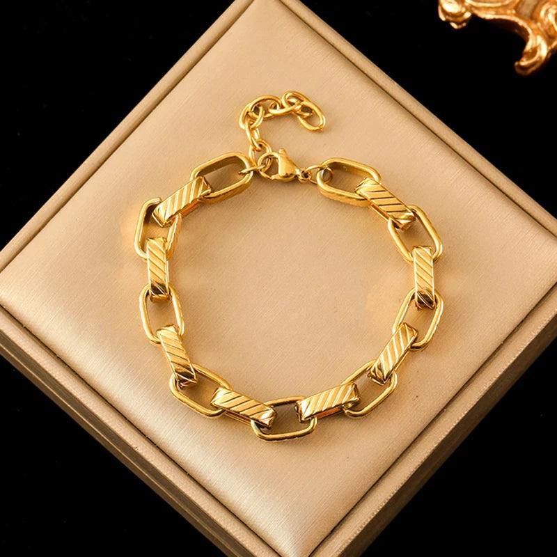 Pulseira de Aço Inoxidável Torcida Banhada a Ouro 18k - Heraki Joias