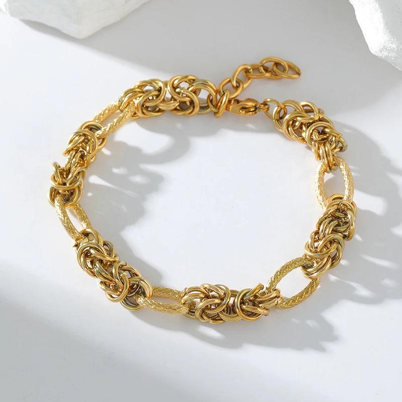 Pulseira de Aço Inoxidável Torcida Banhada a Ouro 18k - Heraki Joias