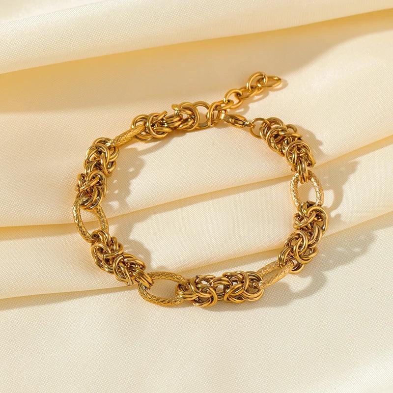Pulseira de Aço Inoxidável Torcida Banhada a Ouro 18k - Heraki Joias