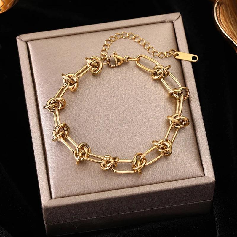 Pulseira de Aço Inoxidável Torcida Banhada a Ouro 18k - Heraki Joias