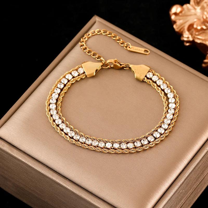 Pulseira de Aço Inoxidável Torcida Banhada a Ouro 18k - Heraki Joias