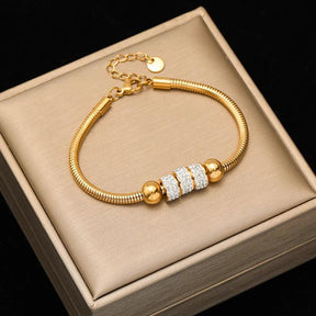 Pulseira de Aço Inoxidável Torcida Banhada a Ouro 18k - Heraki Joias