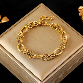 Pulseira de Aço Inoxidável Torcida Banhada a Ouro 18k - Heraki Joias