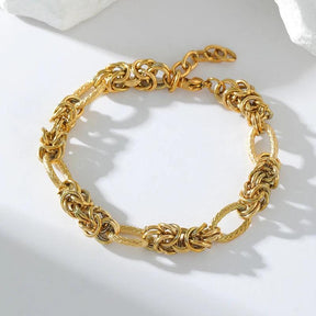 Pulseira de Aço Inoxidável Torcida Banhada a Ouro 18k - Heraki Joias