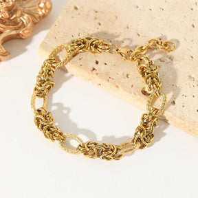 Pulseira de Aço Inoxidável Torcida Banhada a Ouro 18k - Heraki Joias