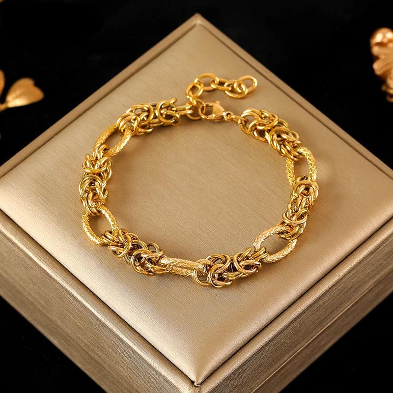 Pulseira de Aço Inoxidável Torcida Banhada a Ouro 18k - Heraki Joias