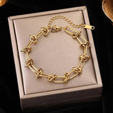 Pulseira de Aço Inoxidável Torcida Banhada a Ouro 18k - Heraki Joias